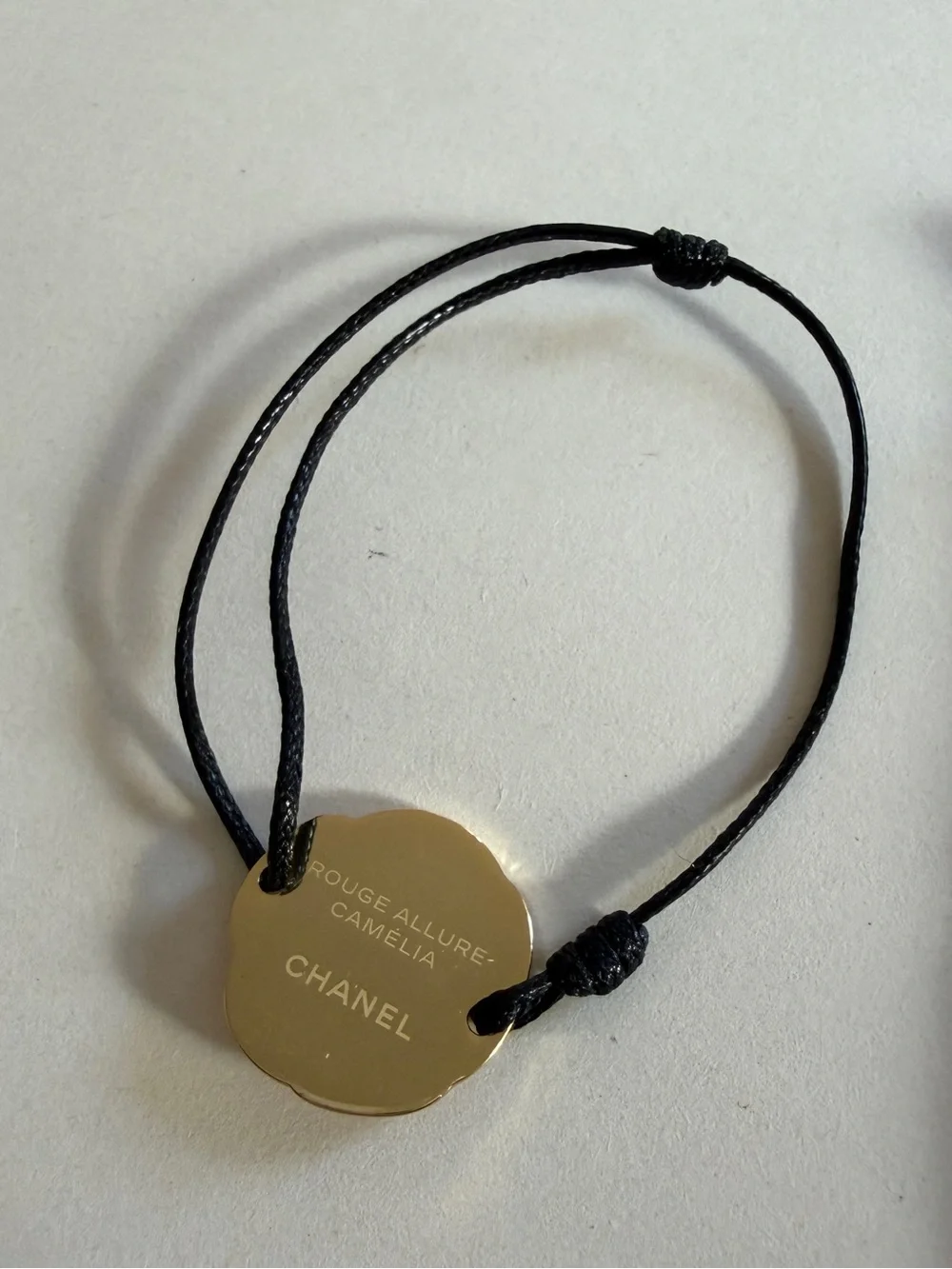 CHANEL CAMELIA CORD BRACELET